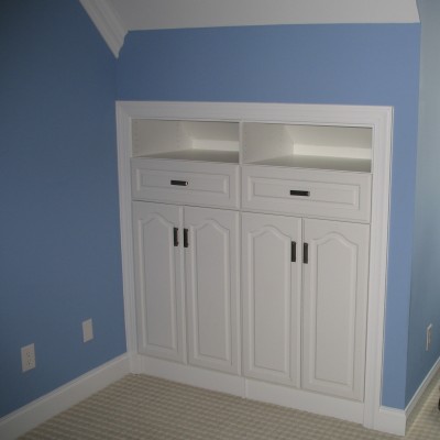 Tucked into a bonus room "knee wall," this built-in (and it's mate) offered a great way to store games and things without taking away play space.