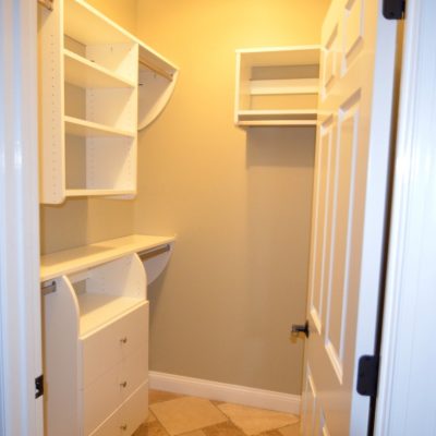 Can't see the other side! But here's half of a symmetrical "his and her's" with some shared long hanging on the back wall. Closet Curves made this entire house of closet upgrades affordable!