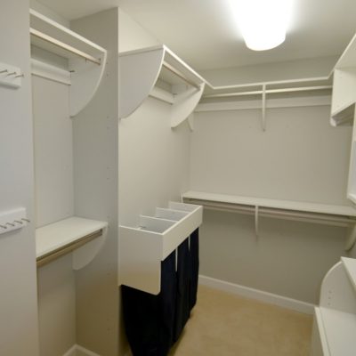 Light, clean and "Curvy." Awesome example of the versatility of "Closet Curves." Single and double hanging, shelves, drawers, and a triple drawstring bag hamper set-up. Excellent utility, excellent value!