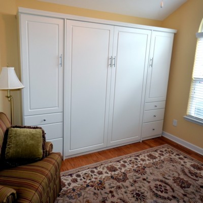 Full time home office, with file storage and more. The upper side cabinets offer pull-out wardrobe rods for hanging clothes, can be replaced with shelves if needed. The queen sized wall bed is ready for guests.