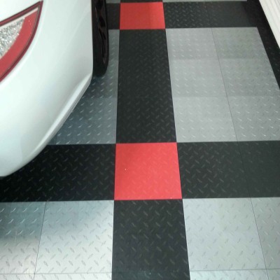 Interlocking Garage Floor Tiles are available in many colors and unlimited patterns.  Very cool!